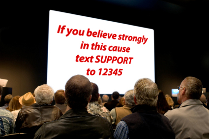 sms marketing call-to-action on screen at an event